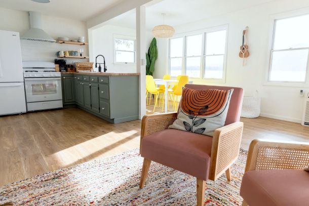 a kitchen with a chair and a table in it