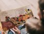 woman reading book to toddler